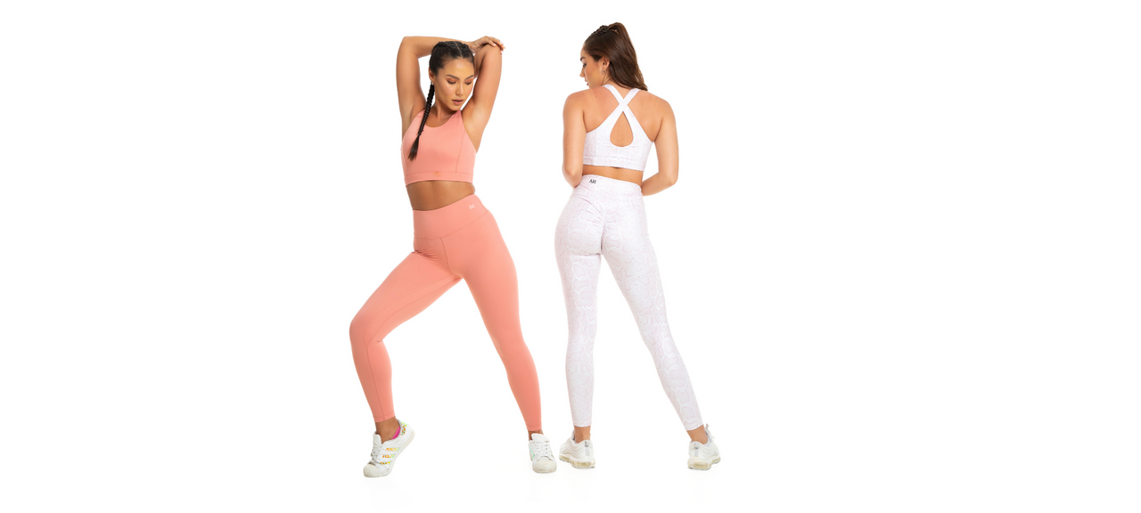  Two girls modelling 1Body leggings and crop top. One is looking at the camera and the other has her back to the camera.